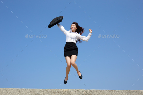 Successful business woman jump (Misc) Photo Download