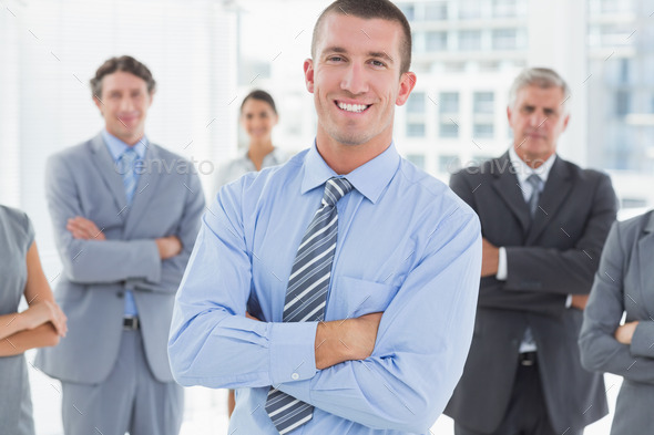 Smiling business team standing with arms crossed in the office (Misc) Photo Download