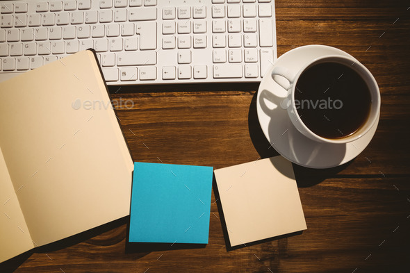 Overhead shot of post its and cup of coffee on a desk