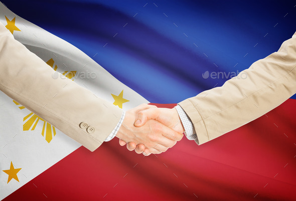 Businessmen handshake with flag on background - Philippines