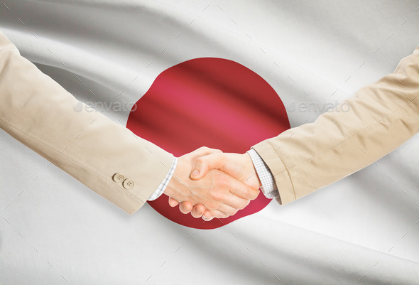 Businessmen handshake with flag on background - Japan