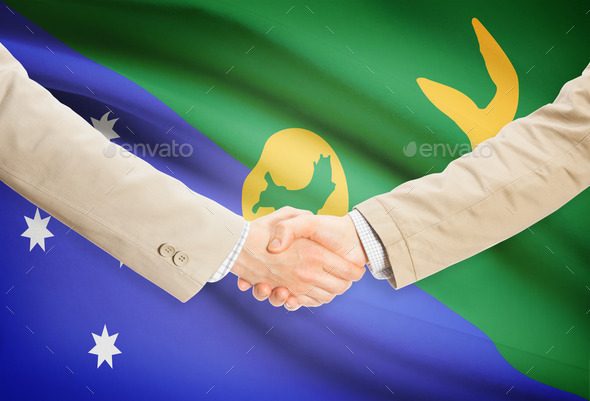 Businessmen handshake with flag on background - Christmas Island