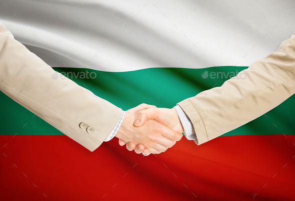 Businessmen handshake with flag on background - Bulgaria