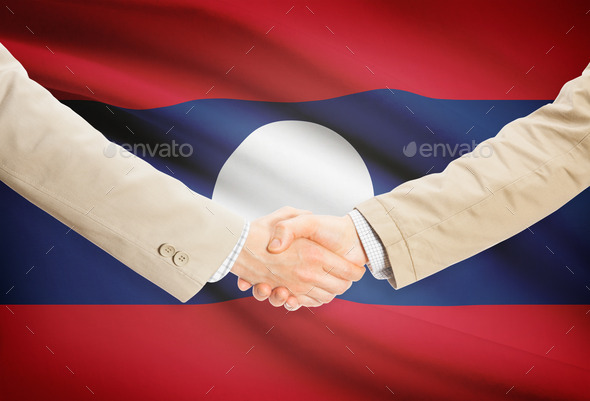 Businessmen handshake with flag on background - Laos