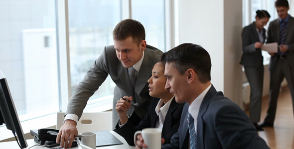 Businessman talking to employees Businessman talking to employees