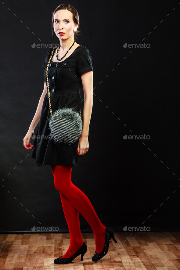 Fashion woman in red tights handbag