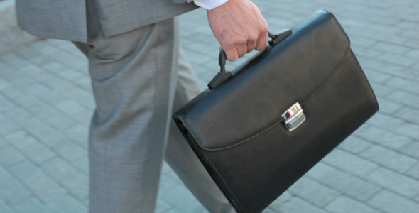 Businessman going down the road Businessman going down the road