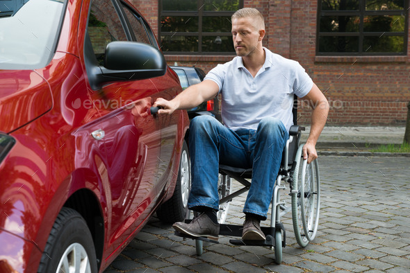 Handicapped Man Opening Door Of A Car