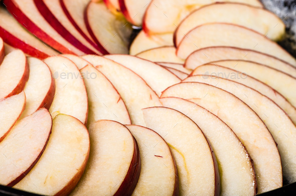 Apple slices arranged in skillet