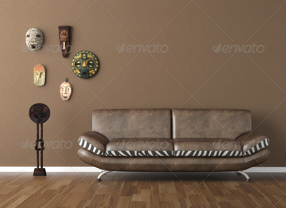 brown wall with tribal masks and couch