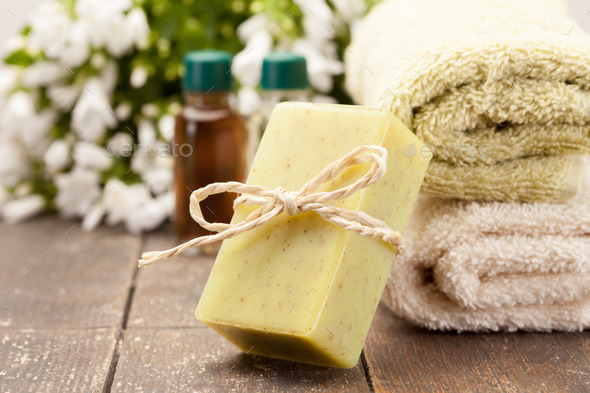 Olive soap over wooden table (Misc) Photo Download