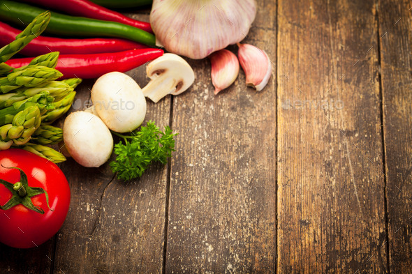 Colorful vegetables over old wooden table (Misc) Photo Download