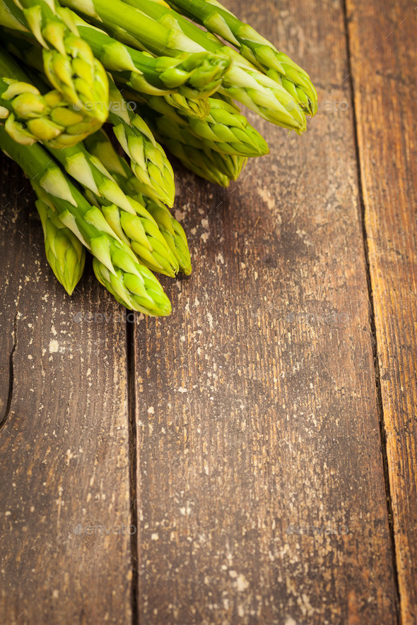 Asparagus over wooden table (Misc) Photo Download