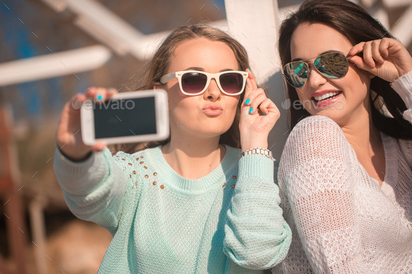 Two girls taking selfie (Misc) Photo Download