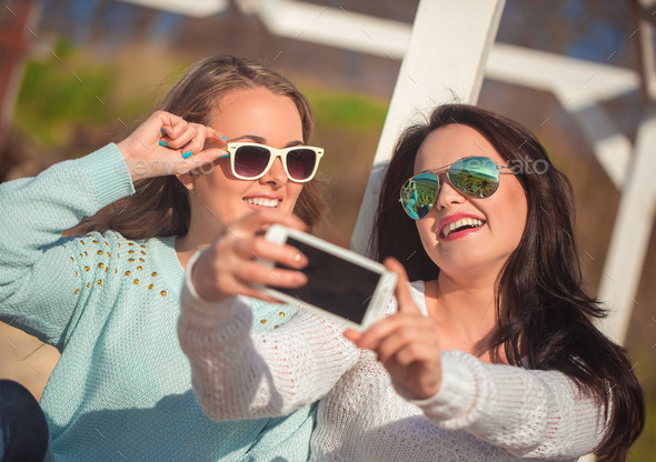 Two girls taking selfie (Misc) Photo Download