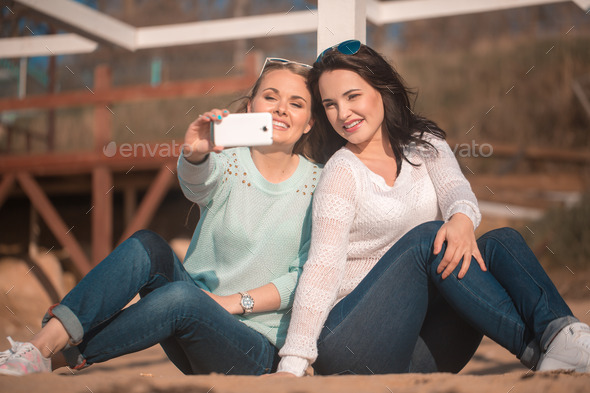 Two girls taking selfie (Misc) Photo Download