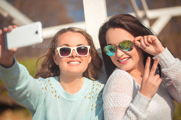 Two girls taking selfie (Misc) Photo Download