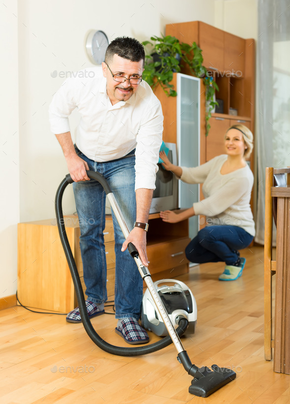 Man and his wife cleaning at home (Misc) Photo Download