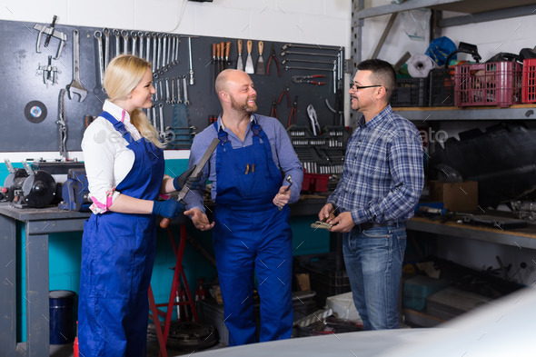 Auto service crew near tools (Misc) Photo Download