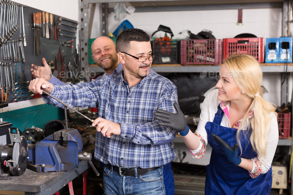 Auto service crew near tools (Misc) Photo Download