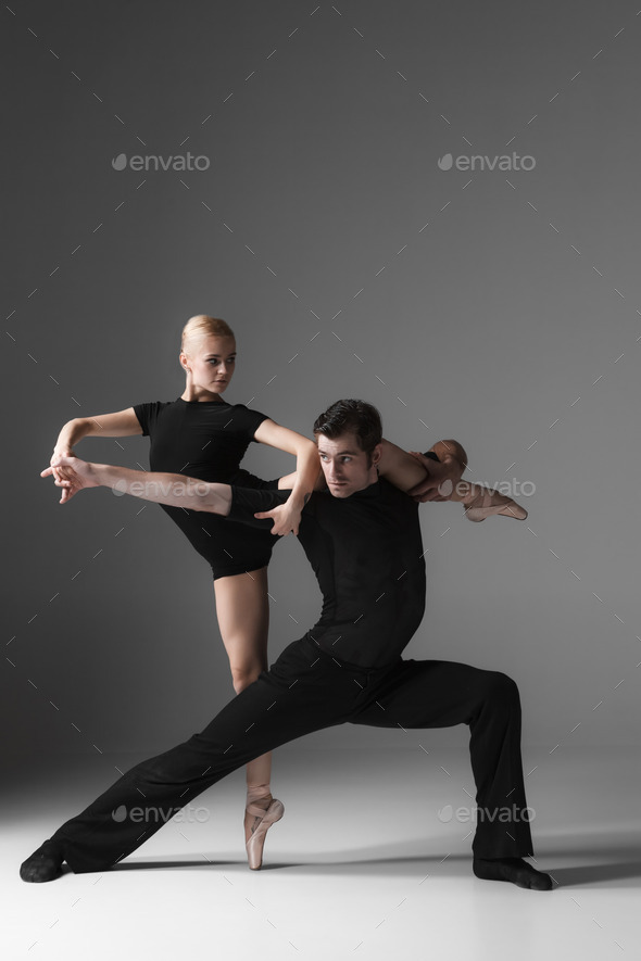 two young modern ballet dancers on gray studio background (Misc) Photo Download