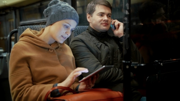 Bus Passengers Using Cellphone And Pad Bus Passengers Using Cellphone And Pad