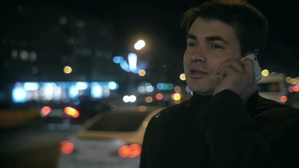 Man Having Phone Conversation Outdoor In Night