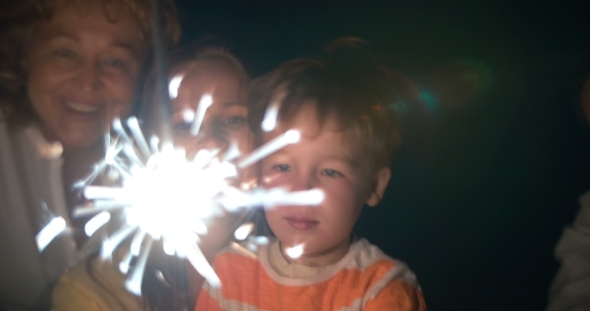 Parents Child And Sparkler At Night Parents Child And Sparkler At Night