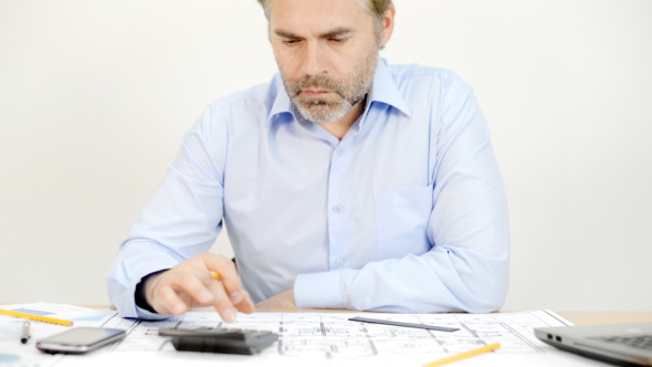 Architect Engineer Doing Calculations Architect Engineer Doing Calculations