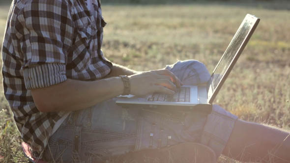 Man Resting at a Laptop in the Park Man Resting at a Laptop in the Park