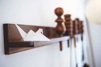 Origami on wooden shelf