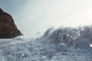 Picture of sea rolling in on a bright day on the beach.