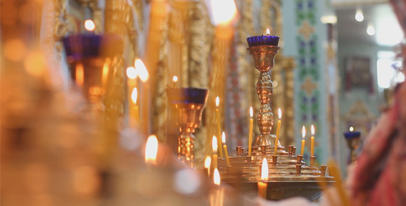 VideoHive Woman Lights Candles in Church 12294156 VideoHive Woman Lights Candles in Church 12294156
