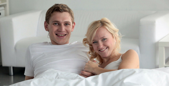 Flirting and kissing in bed Flirting and kissing in bed