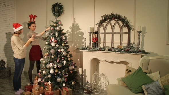 Two Girls Decorating Christmas Tree