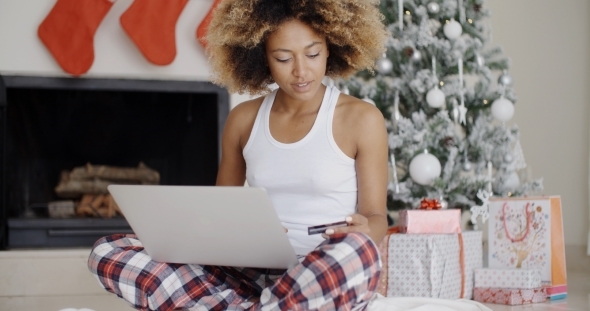 Young Woman Shopping Online For Christmas