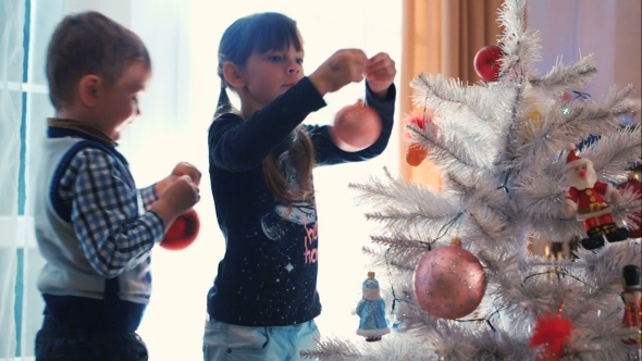 Children Decorating Christmas Tree