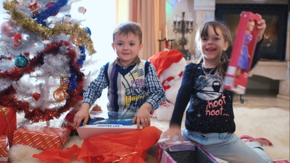 Happy Children With Their Christmas Gifts