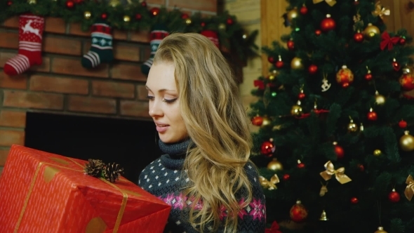 Beautiful Woman With Gifts Around The Christmas