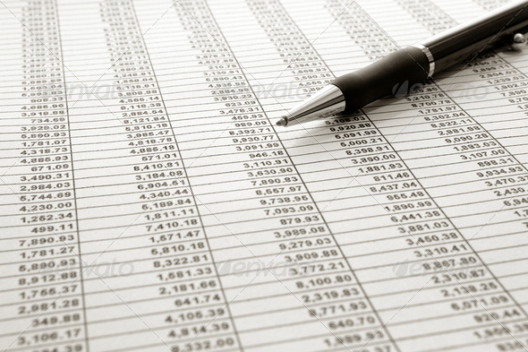 Financial Spreadsheet and Ballpoint Ink Pen