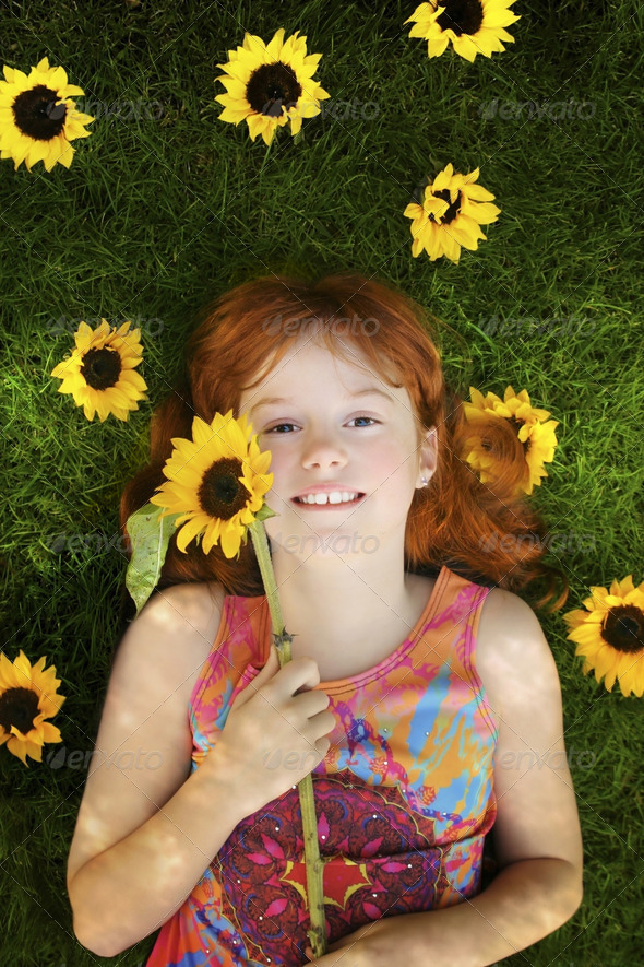 little girl with sunflowers