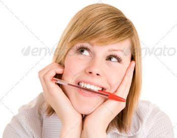 Girl Biting on Pen While in Deep Thought and Looking Up