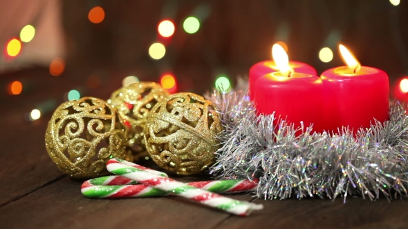 Burning Candles And Christmas Decorations