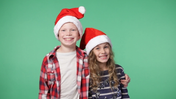 Couple Of Children In Christmas Caps