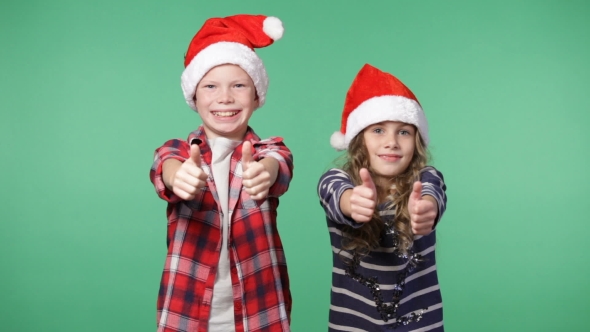 Couple Of Children In Christmas Caps