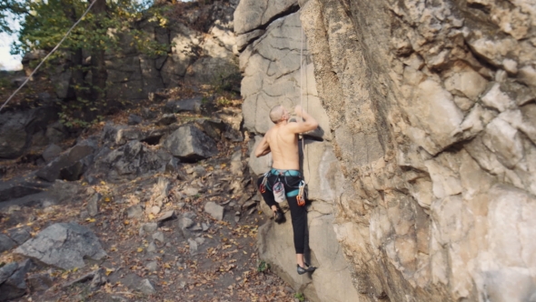 Shirtless Young Man Rock Climbing By Framestock Videohive