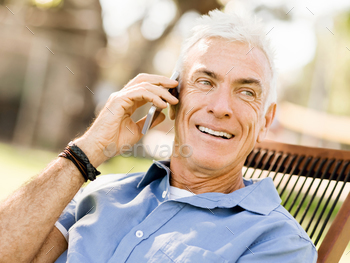 Photodune LoMature man outdoors using mobile phone 18548613