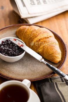 Photodune Tasty buttery croissant with jam. 18737430