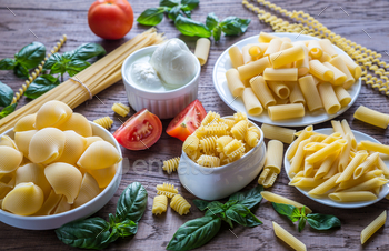 Photodune Various types of pasta on the wooden background 18753190