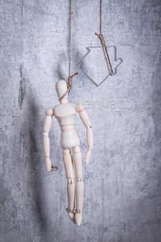 Photodune Wooden figure of human and house in a hangmans loop 18769815